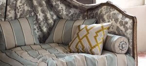 An image showing a chaise lounge with soft furnishings and attractive cushions