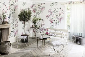 An image showing a floral wallpaper with a white bench and shabby chic decorations